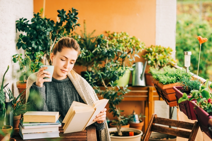 Add a cozy reading nook to your condo balcony design.