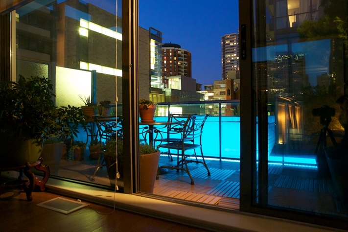 Decorative lights will add ambiance to your condo balcony design.