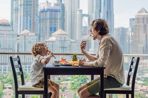 Create a dining area on the condo balcony.